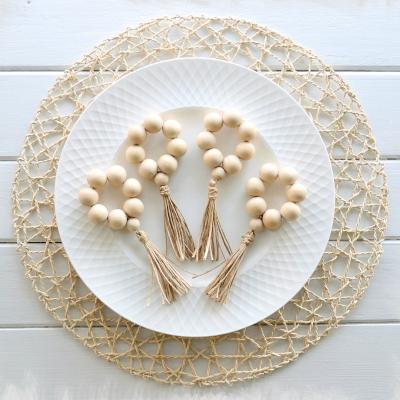 China Pearl Viable Wooden Napkin Rings with Tassels Rustic Farmhouse Wood Bead Garland Wall Hanging Weddings Home Decor Table Decoration for sale