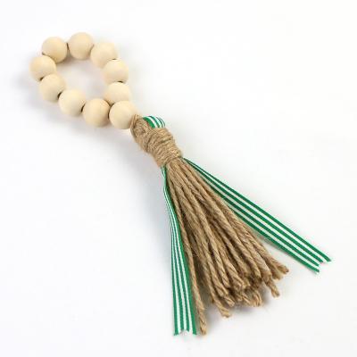 China Wooden Pearl Towel Rings Sustainable Farmhouse Napkin Holders with Jute Tassels for sale