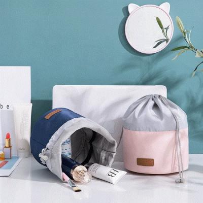 China Waterproof Custom Polyester Round Drawstring Logo Travel Toiletry Organizer Makeup Cosmetic Bag for sale