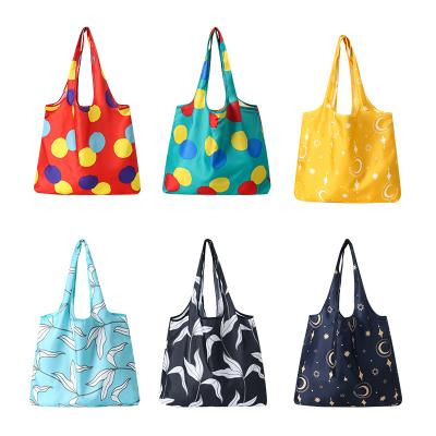 China Custom Designer Folding Reusable Wholesale Portable Supermarket Shopping Bag Print Shop Bag for sale