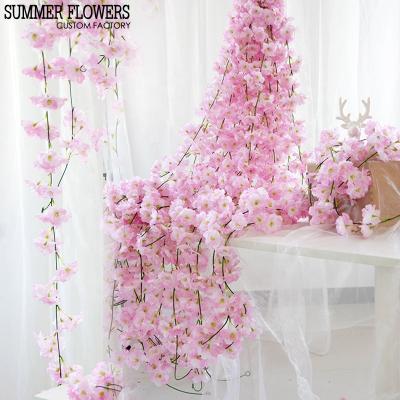 China Customizable Cheap Bulk Wedding Artificial White Silk Decoration 200cm Cherry Blossom Flower Vine For Valentine's Day S-1056 for sale