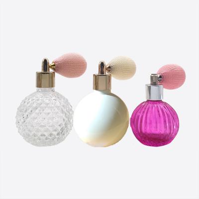 China Personal Care 100ml Clear Black Red Empty Round Glass Cosmetic Bottle With Bulb Atomizer For Perfume Bottle for sale