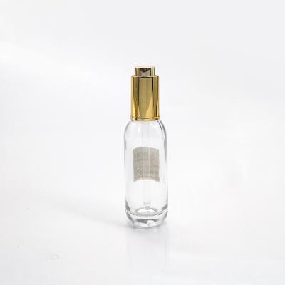 China Personal Care 15ml Unusual Displacement Cosmetic Glass Bottle With Gold Pump Cap for sale