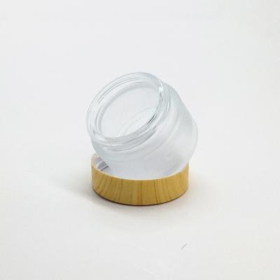 China Personal Care 20g 40g Clear Round Frosted Glass Jar With Bamboo Wooden Lid / Cap for sale