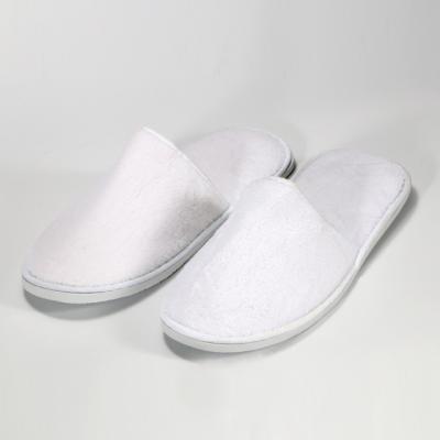 China Custom Coral Disposable Slippers Fleece Hotel Bathroom Slippers With Eva Sole for sale