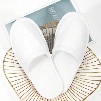 China Exquisite Disposable White Bedroom Slippers Unique Terry Velor EVA Hotel Hotel Amenities Guest Slippers OEM Logo Wholesale Cheap Disposable Custom Made For Spa Cotton Shake for sale