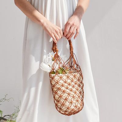 China Handmade Purses 2022 Mesh Straw Woven Tote Designer Summer Bali Women's Factory Direct Sales Fashion Hollow-out Bucket Handbags Beach Bags for sale