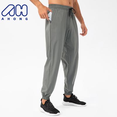 China New Simple Breathable Men's Casual Custom Sports Loose Sweatpants Leisure Training Breathable Pants Tight With Back Pocket for sale