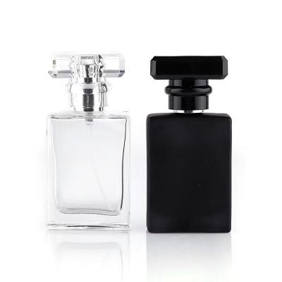 China Free Sample 30ml 50ml Luxury Personal Care Square Spray Glass Perfume Bottle With Colorful Acrylic Cap for sale