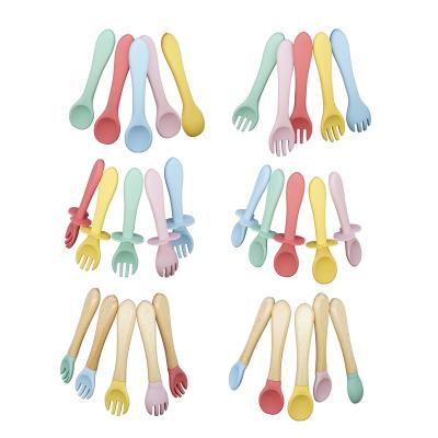 China Soft Baby Product Feeding Tool BPA Washable Wooden Spoon Free Infant Training Flexible Silicone Baby Spoon With Wooden Handle for sale