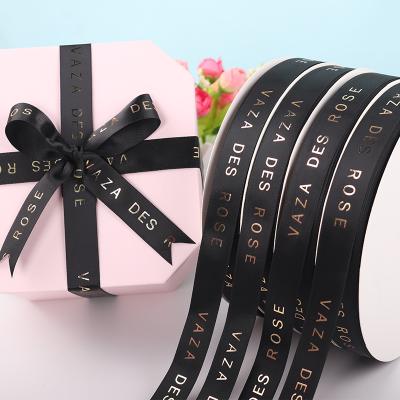 China 100% Luxury Customized Ribbons Metallic Gold Foil Satin 1inch Thread Bronze English Ribbons Gift Ribbon for sale