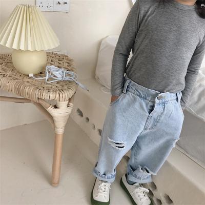 China Sustainable Fashion Kids Loose Ripped Jeans Soft Jeans Kids Custom Kids Jeans for sale