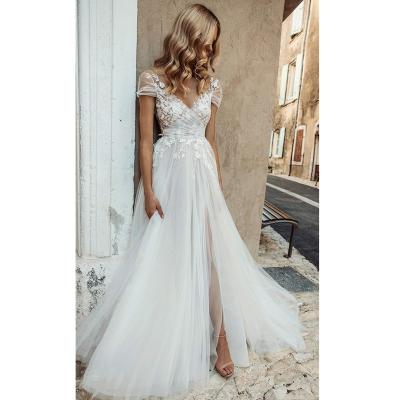 China Breathable Short Sleeve Pleated Low Back Illusion Tulle Wedding Dress A Sheer Neckline Lace Appliqued Fairy Wedding Dress 2022 for sale