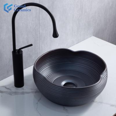 China Modern art modern high quality black ceramic freestanding washbasin for hotel and kitchen for sale