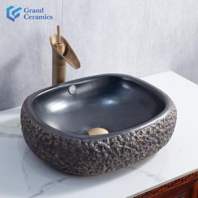 China Hotel Stone Design Modern High Quality Black Art Ceramic Wash Basin Over Counter For Bathroom And Kitchen for sale