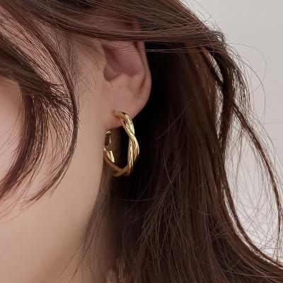 China FASHIONABLE Circle French Braided Korean Simple Temperament Ear Metal Twist Retro Wild Earrings For Women for sale