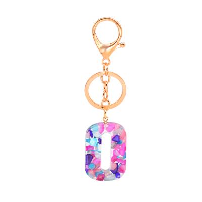 China Handmade Resin and Metal Gold Small Real Stone Digital Shape Resin Car Ring Keychain for Women for sale