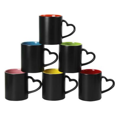 China Viable Wholesale Custom Logo 11 Oz White Sublimation All Black Mugs With Heart Handle for sale