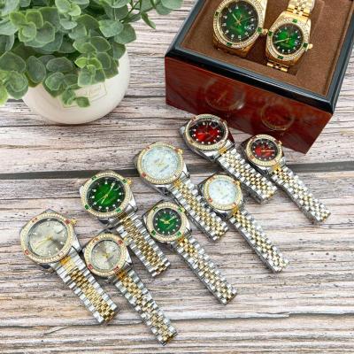 China Automatic Date Custom Iced Out Diamond Watch Dancing Multicolor Studded Watches For Men With Price And Braclets Women Couple for sale