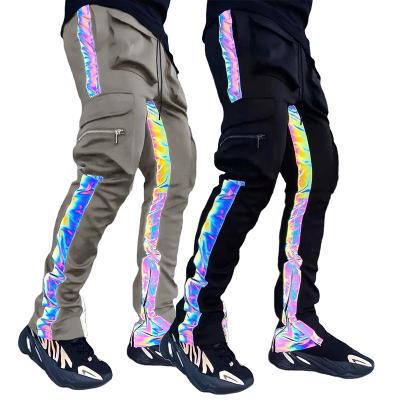 China Anti-wrinkle fashion night running men's slim track pants with hiphop reflective lines 6 pocket pants rainbow joggling reflective trousers for sale