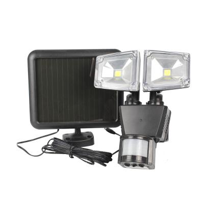 China Solar Powered Warehouse Motion Sensor Activated Double Head Led Spotlight Security COB Light for sale