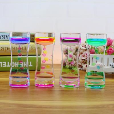 China Eductional Preschool Toys Gift Kids Color Kids Crystal Acrylic Decor Oil Drop Toy Liquid Motion Hourglass for sale