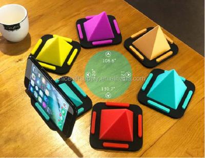 China Multifunctional Silicone Car Navigation Office Home Desktop Silicone Pyramid Mobile Phone Holder for sale