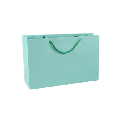 China 2022 handmade fashion clothing store wholesale custom shopping gift bag mint paper bags hot with ribbon cotton rope bag for sale