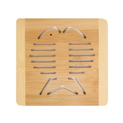 China Minimalist Bamboo Fish Shaped Hollow Coaster Cartoon Insulation Pad Table Mat Anti-Scalding Anti-Skid Mat For Kitchen Table Decoration for sale