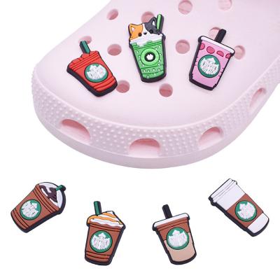 China Clog Charm 2022 New Popular Cartoon Shoe Charms Luxury Coffee Mugs Brand Croc Shoes Charm Decoration Wholesale for sale