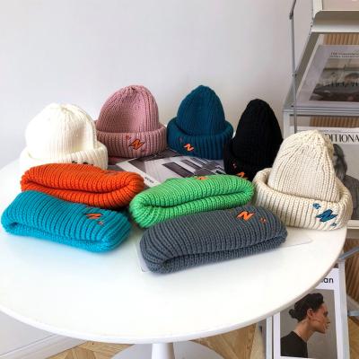 China Fashion COMMON Letter Knitted Hat Joker Warm Beanie For Men And Women for sale