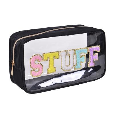 China Durable Waterproof Clear PVC Embroidered Letter Makeup Bag With Large Capacity Travel Wash Storage Bag Convenient Makeup Bag for sale