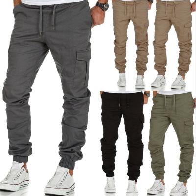 China Waterproof 2021 European And American Machining Solid Color Men Sports Drawstring Multi-pocket Style Casual Tactical Pants for sale