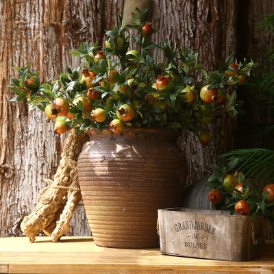 China High quality and colorful high simulation artificial American pomegranate with leaves for indoor and outdoor home decoration for sale