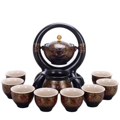 China 360 Degree Sustainable Rotating Ceramic Teapot Lazy Teapot Tea Making Gift Box Tea Set Household Japanese Tea Set for sale