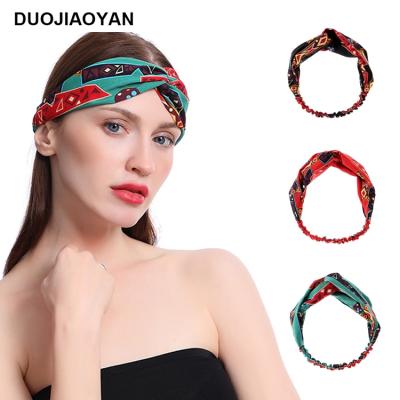 China Fashionable elastic cross headband turban print cotton polyester twist hair band women wide headwrap runner headband for sale