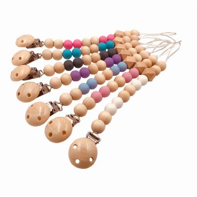 China Newborn Baby Teether Silicone Infant Chew Toys Wooden Milk Teeth Soothe Pacifier Chains for sale