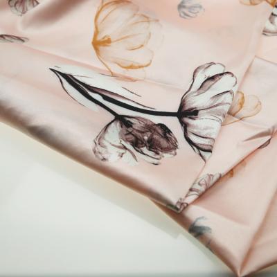 China Memory Stock Polyester Rose Pink Ground Light Flower Printing Lot Woven Satin Fabric For Women Nightgowns for sale