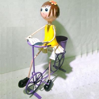 China Modern Metal Girl Ride A Bicycle With A Pot Garden Bicycle Flower Planter Bicycle Ornamental Decoration for sale