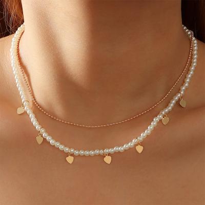 China Double layered beaded necklace gold ball tiny cute pearl chain with small heart charm choker necklace for sale