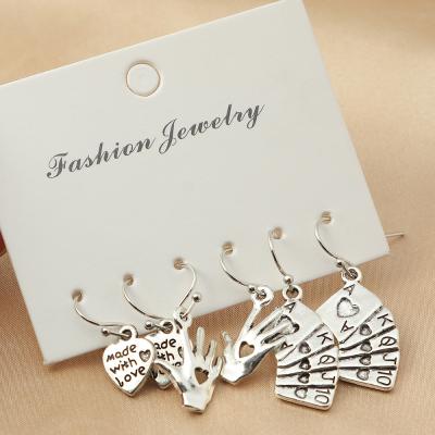 China Vintage Creative Design Silver Plated Drop Earring Set Funny Playing Card Hand Heart Charm Dangle Earrings For Party for sale