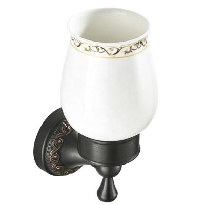 China Wall Mounted Mouthwash Cup Wall Mounted Embossed Black Simple Cup Holder Round Style Retro Household Modern Wholesale Bathroom Chassis for sale