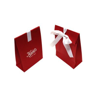 China Small Recyclable Custom Cute Paper Jewelry Gift Bag With Coarse Grain Bow en venta