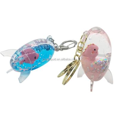 China Floating Key Ring Fashion Gifts for Kids Space Rocket Shape Water Keyring Key Chain Rocket Shape Liquid Floating Quicksand Aqua Key Holder for sale