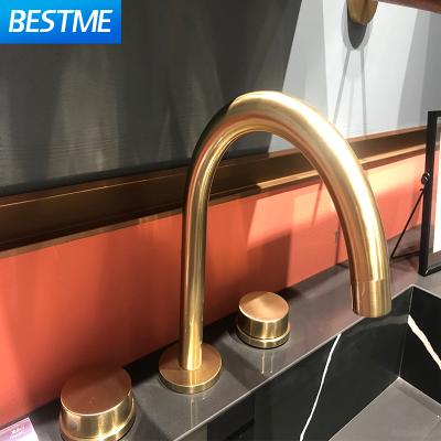 China Modern Brass Metered Hotel Faucets Minispread Hot And Cold Concealed Desk Mounted Sweep Gold Bathroom Basin Faucet for sale