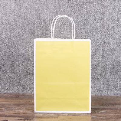 China Recyclable Customized Yellow Shopping Bag Kraft Paper Bags Gift Bag With Handle for sale