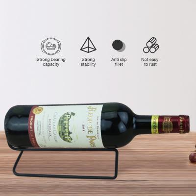 China Sustainable Manufacturer Wholesale Single Bottle Free Standing Wine Bottle Display Holder Black Iron Metal Wine Rack for sale