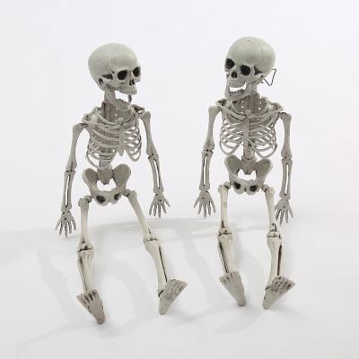 China Halloween 40cm Scary Simulation Human Body Skeleton Plastic Skeleton Room Haunted House Props Human Skeleton Decoration for sale