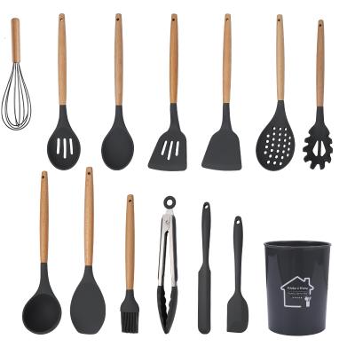 China Amazon Sustainable Hot Selling Food Grade Cooking Tools Kitchen Tableware Silicone Cookware Sets With Wooden Handle Spoon Turner Spatula Tongs for sale