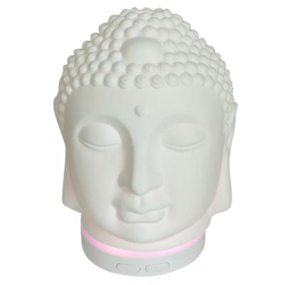 China Zen Buddha Head Shaped Porcelain Ceramic Oil Diffuser Changeable LED Colors Home Fragrance Light for sale